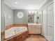 Bathroom features a jetted tub and vanity sink at 733 Killian Rd, Stanley, NC 28164