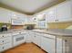 Charming kitchen features white appliances and a sunny window at 733 Killian Rd, Stanley, NC 28164