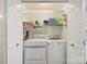 Functional laundry room with washer, dryer and wire shelving storage for laundry supplies at 733 Killian Rd, Stanley, NC 28164