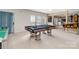 Finished basement game room with sliding glass door to the back yard at 7704 Ninth Fairway Ln, Mint Hill, NC 28227