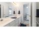 Bright bathroom with double sinks and view to bedroom at 7704 Ninth Fairway Ln, Mint Hill, NC 28227