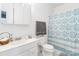 Bright bathroom featuring a white vanity, decorative shower curtain, and neutral-toned towels at 7704 Ninth Fairway Ln, Mint Hill, NC 28227