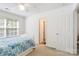 Well-lit bedroom boasts ample natural light and neutral decor at 7704 Ninth Fairway Ln, Mint Hill, NC 28227