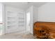 Bright bedroom features built-in bookshelves and a classic roll-top desk at 7704 Ninth Fairway Ln, Mint Hill, NC 28227