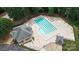 Aerial view of the community pool with abundant seating and umbrellas at 7704 Ninth Fairway Ln, Mint Hill, NC 28227