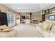 Cozy living room features a brick fireplace and built-in shelving at 7704 Ninth Fairway Ln, Mint Hill, NC 28227