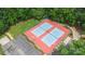 Aerial view of the community tennis courts surrounded by lush trees and landscaping at 7704 Ninth Fairway Ln, Mint Hill, NC 28227