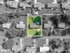 An aerial view outlines the property with lot lines, surrounded by a verdant lawn and mature trees, highlighting its location at 810 Surry Dr, Shelby, NC 28152