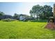 Expansive backyard with a swing set, storage shed, and mature trees, ideal for outdoor fun at 810 Surry Dr, Shelby, NC 28152