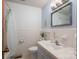 Well-maintained bathroom with a white tiled shower, a vanity with countertop, and a toilet with modern fixtures at 810 Surry Dr, Shelby, NC 28152