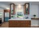 Charming kitchen with quartz countertops, wood cabinetry, modern appliances, and a view of the backyard at 810 Surry Dr, Shelby, NC 28152