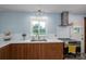 Updated kitchen featuring stainless steel appliances, wooden cabinets, white subway tiles and great natural light at 810 Surry Dr, Shelby, NC 28152