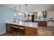Modern kitchen featuring an island with seating and stainless steel appliances at 810 Surry Dr, Shelby, NC 28152