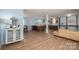 Open-concept living room with hardwood floors, seamlessly flowing into the kitchen at 810 Surry Dr, Shelby, NC 28152