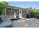 Outdoor patio area with comfortable seating and a grill, perfect for relaxing or entertaining at 810 Surry Dr, Shelby, NC 28152