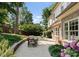Charming backyard patio with outdoor dining and lounge areas, and beautiful landscaping at 901 Hartford Ave, Charlotte, NC 28209
