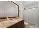 Traditional bathroom with a granite countertop vanity and a shower-tub combination at 901 Hartford Ave, Charlotte, NC 28209