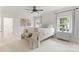 Bright and airy bedroom with a large bed, soft carpeting, and abundant natural light, showcasing a clean and modern design at 901 Hartford Ave, Charlotte, NC 28209
