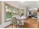Bright breakfast nook with large windows overlooking the landscaped backyard at 901 Hartford Ave, Charlotte, NC 28209