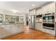 Gourmet kitchen featuring stainless steel appliances, including double ovens, and a center island at 901 Hartford Ave, Charlotte, NC 28209