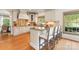 Spacious kitchen island featuring granite countertops, ample cabinet space and bar stool seating at 901 Hartford Ave, Charlotte, NC 28209