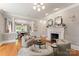 Elegant living room features a fireplace and plenty of natural light at 901 Hartford Ave, Charlotte, NC 28209