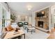 Cozy living room features stone fireplace and plenty of natural light at 901 Hartford Ave, Charlotte, NC 28209