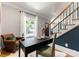 Well-appointed home office nook with a comfortable leather chair, desk space, and natural light streaming through the window at 901 Hartford Ave, Charlotte, NC 28209