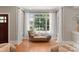 Relaxing sitting area with a chaise lounge and large windows at 901 Hartford Ave, Charlotte, NC 28209