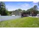 Spacious backyard with lush green grass and a charming deck area at 10012 Michael Crossing Dr, Charlotte, NC 28213