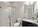 Modern bathroom featuring a glass-enclosed shower, sleek vanity, and granite countertops at 10012 Michael Crossing Dr, Charlotte, NC 28213