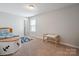 Bedroom featuring neutral walls, carpet, and a bed with storage at 10012 Michael Crossing Dr, Charlotte, NC 28213