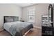 Comfortable bedroom with a neutral color palette, a window, and a ceiling fan at 10012 Michael Crossing Dr, Charlotte, NC 28213
