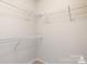 Walk-in closet with wall-mounted, adjustable shelving at 10012 Michael Crossing Dr, Charlotte, NC 28213