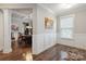 Open-concept room with dining table that connects to the kitchen and other rooms at 10012 Michael Crossing Dr, Charlotte, NC 28213