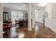 Spacious dining area featuring decorative columns, elegant furniture, and easy access to the front door and rooms at 10012 Michael Crossing Dr, Charlotte, NC 28213