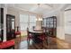 Bright dining room with a decorative cabinet, stylish chairs, and a chandelier creating a warm ambiance at 10012 Michael Crossing Dr, Charlotte, NC 28213