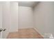 Neutral, carpeted room staged virtually, ready for your personal design and finishing touches at 10012 Michael Crossing Dr, Charlotte, NC 28213