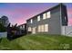 View of house exterior and backyard with deck and lush lawn at 10012 Michael Crossing Dr, Charlotte, NC 28213