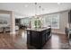 Spacious kitchen featuring a large island, granite countertops, and modern appliances at 10012 Michael Crossing Dr, Charlotte, NC 28213