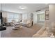 Comfortable living room featuring neutral tones and ample seating at 10012 Michael Crossing Dr, Charlotte, NC 28213
