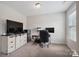 Bright home office space featuring neutral walls, carpet, and desk with rolling chair at 10012 Michael Crossing Dr, Charlotte, NC 28213