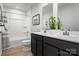 Well-lit bathroom with a combination shower-tub, toilet, and contemporary vanity, designed for modern living at 10112 Florentine Ln, Charlotte, NC 28214