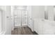 Modern bathroom with a glass-enclosed shower, a dual sink vanity and hard surface floors at 10112 Florentine Ln, Charlotte, NC 28214