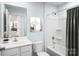 Bright bathroom with a shower-tub combo and a classic white vanity at 10112 Florentine Ln, Charlotte, NC 28214