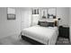 Sleek bedroom featuring minimalist decor, cozy bedding, and ample natural light for a restful ambiance at 10112 Florentine Ln, Charlotte, NC 28214