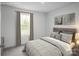 Comfortable bedroom featuring a bed, soft color palette, and a bright window view at 10112 Florentine Ln, Charlotte, NC 28214