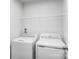 Efficient laundry room with washer, dryer, and wire shelving for organized storage solutions at 10112 Florentine Ln, Charlotte, NC 28214