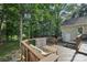 Backyard deck with hot tub and seating areas, perfect for outdoor entertaining and relaxation at 10311 Windtree Ln, Charlotte, NC 28215