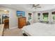 Bedroom with natural lighting, wood blinds, and view to kitchen and dining room at 10311 Windtree Ln, Charlotte, NC 28215